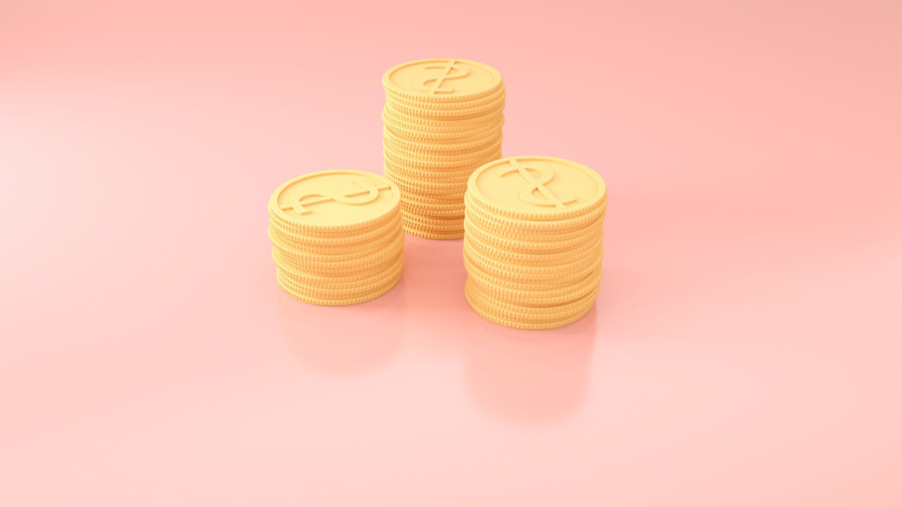 3D render of gold coin stacks on pastel pink, symbolizing wealth and prosperity.